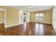 Spacious living room with hardwood floors, built-in shelves, and lots of natural light at 110 W Buckeye St, Cicero, IN 46034