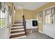 Mudroom featuring a washer and dryer, stairs, and windows at 110 W Buckeye St, Cicero, IN 46034