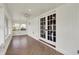Bright sunroom featuring tile flooring, white paneled walls, and a ceiling fan at 110 W Buckeye St, Cicero, IN 46034