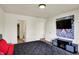 Bedroom featuring a TV, wood floors, a modern interior design, and access to a closet at 11603 Presidio Dr, Indianapolis, IN 46235