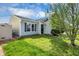 Inviting home exterior with green lawn and attractive landscaping, nestled in a friendly neighborhood at 11603 Presidio Dr, Indianapolis, IN 46235