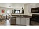 This kitchen seamlessly flows into the dining area and features stainless steel appliances and modern finishes at 11603 Presidio Dr, Indianapolis, IN 46235