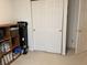 View of a standard-sized closet, with white doors and brass hardware at 11875 Buck Creek Cir, Noblesville, IN 46060