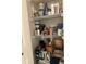 Pantry shelves with storage baskets and personal care products at 11875 Buck Creek Cir, Noblesville, IN 46060