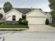 Charming single-story home with a two-car garage and well-maintained landscaping at 11875 Buck Creek Cir, Noblesville, IN 46060