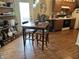 Eat-in kitchen with wooden table and chairs and modern appliances at 11875 Buck Creek Cir, Noblesville, IN 46060