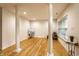 Finished basement with hardwood floors, decorative columns, and natural light at 11905 Kelso Dr # 3, Zionsville, IN 46077
