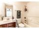 Bathroom featuring a single vanity, framed mirror, garden tub, showerhead and white walls at 11905 Kelso Dr # 3, Zionsville, IN 46077