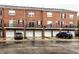 Brick townhome featuring individual garages and personal balconies on the second level at 11905 Kelso Dr # 3, Zionsville, IN 46077