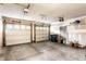 Spacious two-car garage with concrete floor and white doors at 11905 Kelso Dr # 3, Zionsville, IN 46077