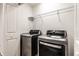 Laundry room featuring white walls, modern washer and dryer, and wire shelving for storage at 11905 Kelso Dr # 3, Zionsville, IN 46077