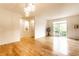 Bright, open-concept living area with hardwood floors and a decorative wall niche at 11905 Kelso Dr # 3, Zionsville, IN 46077