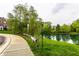 Beautiful pond with surrounding trees and landscaping, offering a serene and natural setting at 11905 Kelso Dr # 3, Zionsville, IN 46077