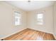 This cozy bedroom boasts two windows, hardwood floors, and is bathed in natural light at 1231 Nester St, Speedway, IN 46224