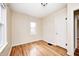 A bright bedroom features hardwood floors, a window, and a closet space at 1231 Nester St, Speedway, IN 46224
