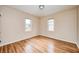 Comfortable bedroom with hardwood floors and plenty of natural light from two windows at 1231 Nester St, Speedway, IN 46224