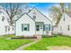 Charming home featuring a well-maintained front yard and classic architectural details at 1231 Nester St, Speedway, IN 46224