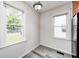 Sunlit kitchen nook with vinyl floors, natural light, and a view of the street at 1231 Nester St, Speedway, IN 46224
