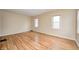 Spacious living room featuring hardwood floors, neutral paint, and bright natural light at 1231 Nester St, Speedway, IN 46224