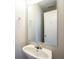 Close up of a bathroom sink and mirror with neutral decor providing a relaxing space at 12704 Bearsdale Dr, Indianapolis, IN 46235