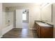 Bathroom with a bath-shower, a large mirror, and modern fixtures, and a neutral color scheme at 12704 Bearsdale Dr, Indianapolis, IN 46235