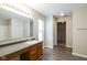 Bright bathroom with a spacious vanity, large mirror, and a well-lit, inviting atmosphere at 12704 Bearsdale Dr, Indianapolis, IN 46235
