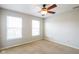 Comfortable carpeted bedroom with a ceiling fan and bright windows at 12704 Bearsdale Dr, Indianapolis, IN 46235