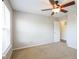 Comfortable carpeted bedroom with a ceiling fan and a conveniently located doorway at 12704 Bearsdale Dr, Indianapolis, IN 46235