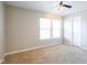 Bright, airy bedroom features a large window and ceiling fan, creating a serene retreat at 12704 Bearsdale Dr, Indianapolis, IN 46235