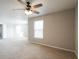 Cozy bedroom featuring a ceiling fan and neutral carpet, ideal for comfortable living at 12704 Bearsdale Dr, Indianapolis, IN 46235