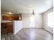 View of the dining room with hardwood floors and neutral paint, and a vintage chandelier at 12704 Bearsdale Dr, Indianapolis, IN 46235