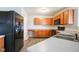 The kitchen features sleek black appliances, lots of cabinet space and bright countertops at 12704 Bearsdale Dr, Indianapolis, IN 46235