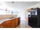The kitchen offers plenty of countertop space, black appliances, and seamless flow to adjacent rooms at 12704 Bearsdale Dr, Indianapolis, IN 46235