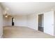 Open floor plan with neutral carpet flowing into the living room and kitchen area at 12704 Bearsdale Dr, Indianapolis, IN 46235