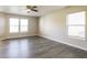 Bright living room featuring durable gray flooring and ample natural light at 12704 Bearsdale Dr, Indianapolis, IN 46235
