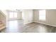 Bright living room features new flooring and plenty of natural light from the multiple windows at 12704 Bearsdale Dr, Indianapolis, IN 46235