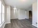 This living room features gray hardwood floors and neutrally painted walls, creating a welcoming space at 12704 Bearsdale Dr, Indianapolis, IN 46235