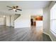 Open-concept living space with modern flooring that flows into a well-lit kitchen area at 12704 Bearsdale Dr, Indianapolis, IN 46235