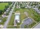 Aerial view of neighborhood featuring houses, a pool and community center at 12981 Coyote Run, Fishers, IN 46038