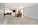 Open-concept dining area with ample space, neutral decor, and views into the living area at 12981 Coyote Run, Fishers, IN 46038