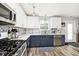 Modern kitchen featuring stainless steel appliances, ample counter space, and stylish backsplash at 12981 Coyote Run, Fishers, IN 46038