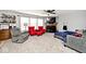 Spacious living room with fireplace, natural light from windows, and a layout for comfortable living at 12981 Coyote Run, Fishers, IN 46038