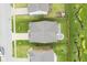Aerial view of a backyard featuring a fire pit with chairs, well-kept lawn, and privacy fence at 1299 W Crystal Dr, Fortville, IN 46040