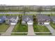 Aerial view of a two-story house with a well-kept lawn, two car garage, and inviting landscaping at 1299 W Crystal Dr, Fortville, IN 46040
