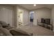 Finished basement with cozy seating, a mini-fridge, and views of the bathroom and bedroom at 1299 W Crystal Dr, Fortville, IN 46040