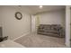 Comfortable basement featuring a cozy couch and adjacent bathroom at 1299 W Crystal Dr, Fortville, IN 46040