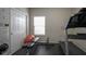 Home gym features a treadmill, weight bench, and rubber flooring at 1299 W Crystal Dr, Fortville, IN 46040