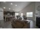 Spacious living room featuring hardwood floors, neutral walls, and a vaulted ceiling at 1299 W Crystal Dr, Fortville, IN 46040
