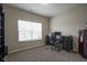 Cozy office includes desk, shelves, a printer, and large window at 1299 W Crystal Dr, Fortville, IN 46040