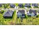 An aerial shot features homes with well-kept yards and mature trees creating a picturesque setting at 14349 Marsdale Pl, Carmel, IN 46074
